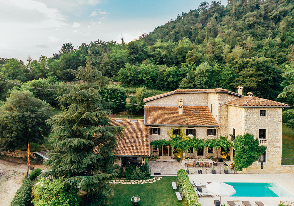 Aerial view of a luxury villa with swimming pool in Italy